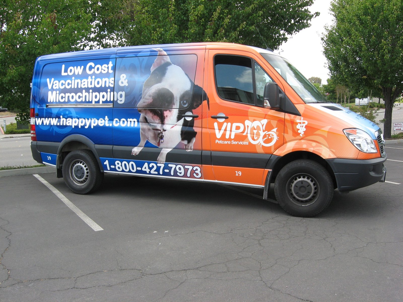 Commercial van with a full red, black and white vehicle wrap